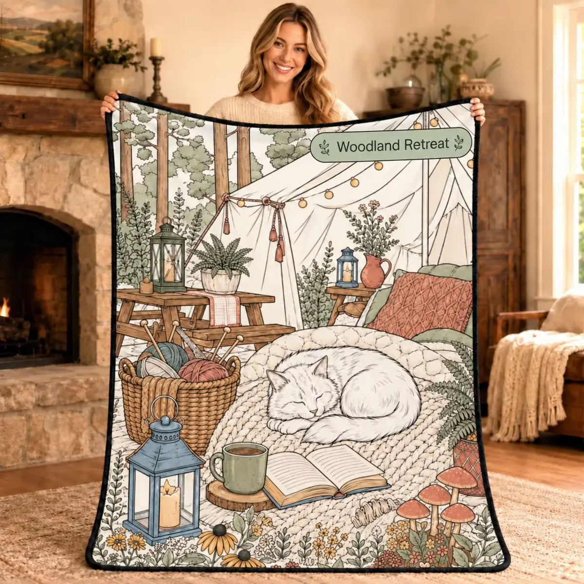 Woman holding the Woodland Retreat coloring blanket design, a cat sleeping in a forest tent scene